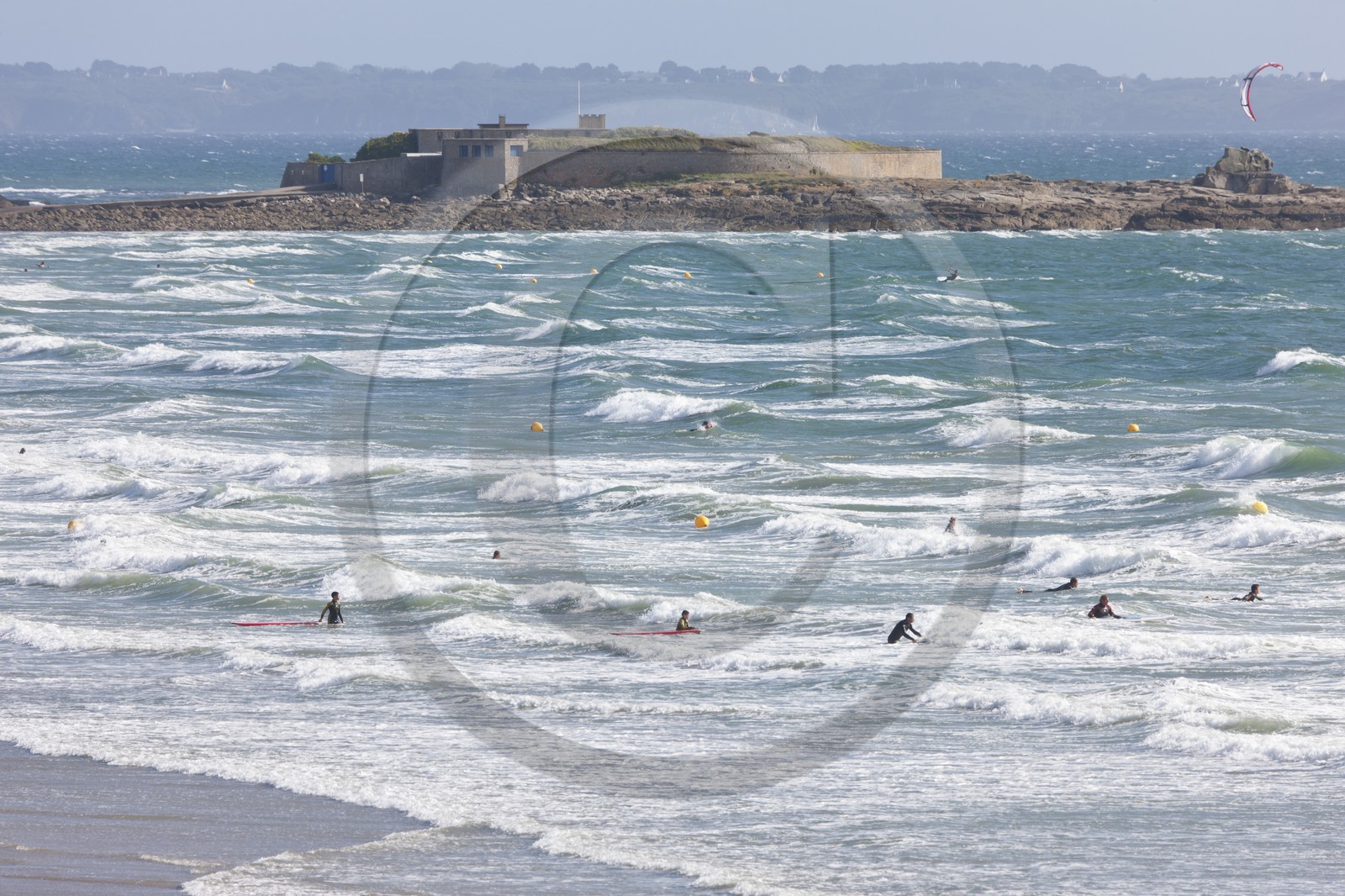 Surfers enjoy the waves on the beach of Pen-er-Malo_Guidel
