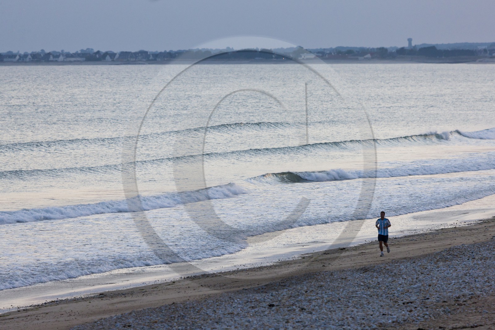Jogger on the beach of Loch in Guidel.Morbihan
